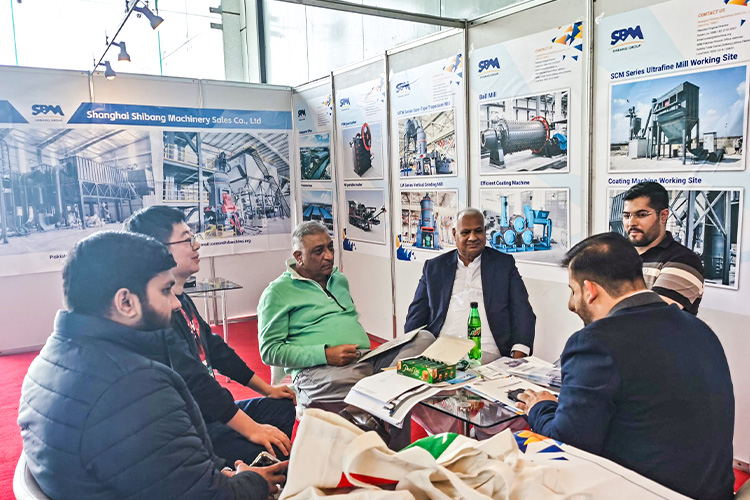 Engaging conversation between our team and a client at the exhibition